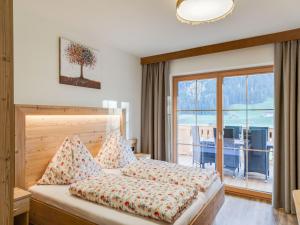 Ένα ή περισσότερα κρεβάτια σε δωμάτιο στο Apartment in Wald near Zillertal Ski Arena
