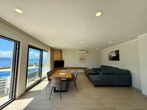 a living room with a couch and a table at Apartment in Croatia near the Adriatic Coast in Crikvenica
