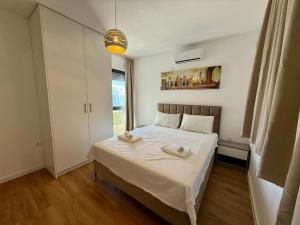 a bedroom with a bed with two towels on it at Apartment in Croatia near the Adriatic Coast in Crikvenica +23 photos