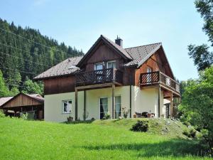 a house on top of a grassy hill at Holiday Home in Radstadt with Sauna & Whirlpool in Löbenau