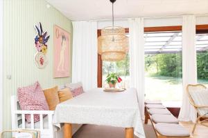 a dining room with a white table and chairs at 10000-1-Rorvig-Birkealle-2-A in Rørvig +23 photos