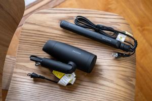 two microphones sitting on a wooden table at HITOYADO kanazawa in Kanazawa
