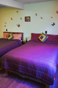 Voodi või voodid majutusasutuse SiempreViva Hospedaje By GEstores toas