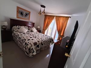 Ένα ή περισσότερα κρεβάτια σε δωμάτιο στο Hogar M&N