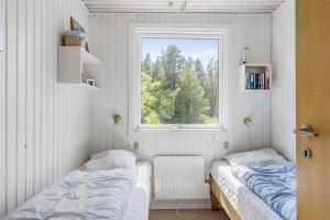 Ένα ή περισσότερα κρεβάτια σε δωμάτιο στο LF10236-Thyholm-Svinget-18