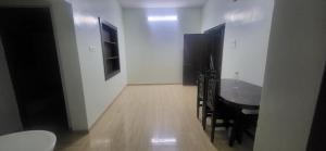 a dining room with a table and chairs in a room at Serene Steps Orion in Coimbatore