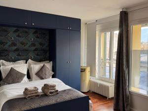 Ένα ή περισσότερα κρεβάτια σε δωμάτιο στο Grand Studio avec balcon, fibre internet - FR-1-555-121