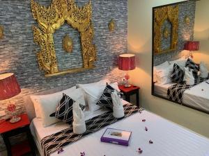 Voodi või voodid majutusasutuse Fong Kaew and Baan Nang Fa Guesthouse toas