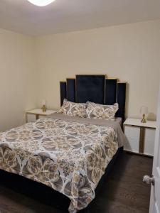 a bedroom with a bed and two night stands at Newly Renovated 3BR Upper Unit - Bright & Quiet in Richmond Hill