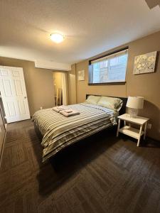 a bedroom with a large bed and a window at Peaceful House with Backyard in Langley