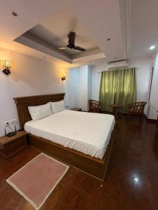 Postel nebo postele na pokoji v ubytování Rozana Retreats BeachVibe -kannur