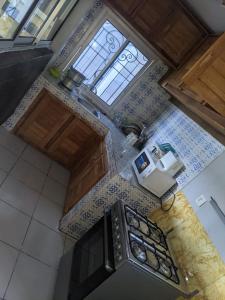 Kuchyň nebo kuchyňský kout v ubytování Endjilo luxueuse Home