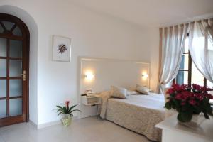 Postel nebo postele na pokoji v ubytování Hotel Barsalini