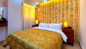 Ένα ή περισσότερα κρεβάτια σε δωμάτιο στο Pyramids Guest House View Hotel