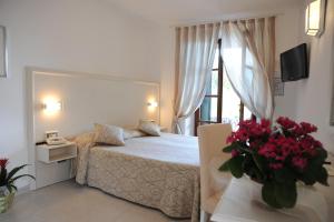 Postel nebo postele na pokoji v ubytování Hotel Barsalini