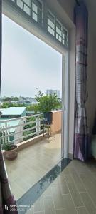 an open door to a balcony with a view at Thuy's homestay in Vung Tau