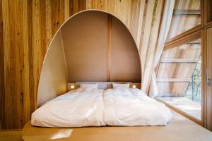 Postel nebo postele na pokoji v ubytování SANU 2nd Home 軽井沢1st