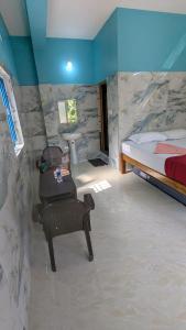 Postel nebo postele na pokoji v ubytování Nandish Guest House + 8 fotografií