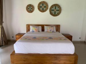 Ένα ή περισσότερα κρεβάτια σε δωμάτιο στο Omah Jegeg