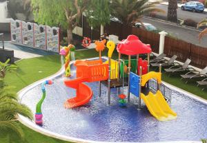 a pool with a water park with a playground at Vitalclass Lanzarote Resort in Costa Teguise