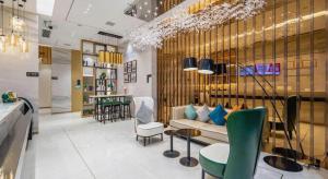 a lobby with a couch and chairs in a store at City Comfort Inn Zhaoqing Qixingyan Yihua Plaza Agile City in Zhaoqing