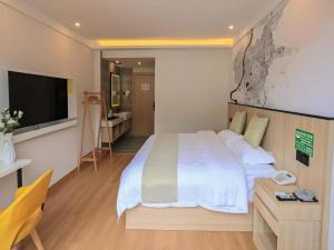 Μια τηλεόραση ή/και κέντρο ψυχαγωγίας στο Vatica Hotel Huangshan South Gate Terminal Station