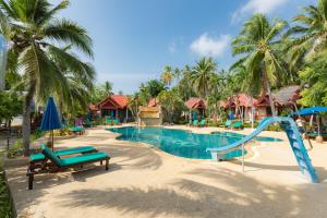 a resort swimming pool with a slide and slides at Dream Team Beach Resort in Ko Lanta