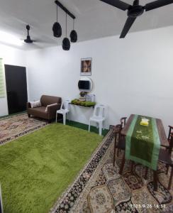 Et opholdsområde på 28 Pauh Indah Homestay