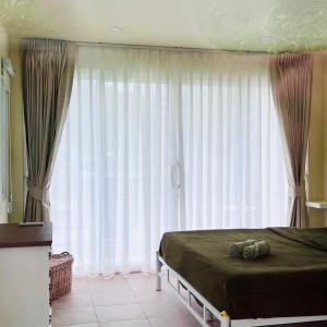 Postel nebo postele na pokoji v ubytování Coco Healing 2