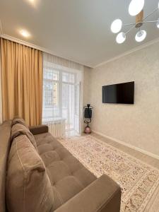 Μια τηλεόραση ή/και κέντρο ψυχαγωγίας στο ЖК ТОЛЕ БИ район Хан Шатыр