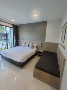 Ένα ή περισσότερα κρεβάτια σε δωμάτιο στο BLU-LIB Hotel