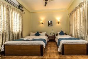 En eller flere senge i et værelse på Hotel Orchid - Family-Run, Family-Care