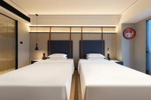 Imagem da galeria de FunGeeX Hotel Qingdao Zhengyang Middle Road MixC Store em Qingdao