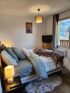 Ένα ή περισσότερα κρεβάτια σε δωμάτιο στο Apart'hôtel 6 personnes centre et cœur station