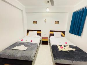 Postel nebo postele na pokoji v ubytování nile shores hotel