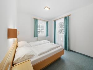 a bedroom with a bed and a window at Apartment in a quiet location in Mittersill in Mittersill
