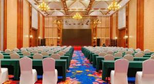 a large room with chairs and a screen in it at Xinjin Celebrity City Hotel in Xinjin +291 photos