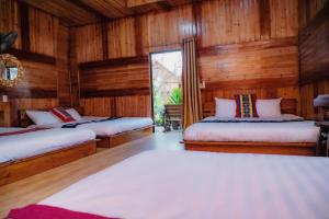 Postel nebo postele na pokoji v ubytování Bắc Hà Green Homestay