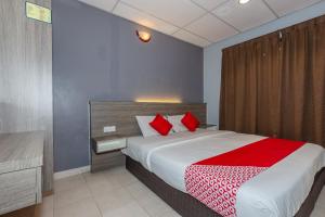 Ένα ή περισσότερα κρεβάτια σε δωμάτιο στο OYO 91258 Qish Hotel Banda Kaba