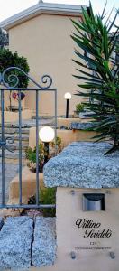 a set of stairs leading to a building at Villino Tiriddò Porto San Paolo in Porto San Paolo