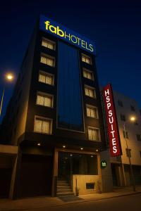 a tall building with a sign on top of it at FabHotel HSP Suites - Near IGI Airport - New Delhi in New Delhi