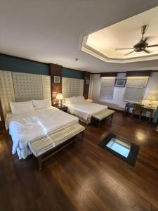 Ένα ή περισσότερα κρεβάτια σε δωμάτιο στο Grand Pool Villa Luxury Resort Port Dickson