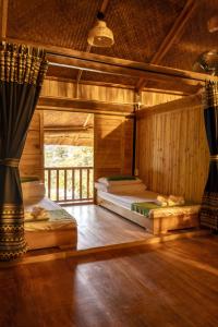 Ένα ή περισσότερα κρεβάτια σε δωμάτιο στο An Station - Dorm & Onsen packaged