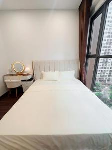 Ένα ή περισσότερα κρεβάτια σε δωμάτιο στο Bunnys Homes - Managed by WiWi - Vinhomes Ocean Park