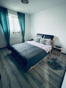 Ένα ή περισσότερα κρεβάτια σε δωμάτιο στο Magnolia Residence K&A