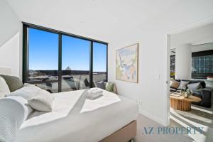 Ένα ή περισσότερα κρεβάτια σε δωμάτιο στο Prime Location CBD with Pool & Gym