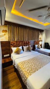 Postel nebo postele na pokoji v ubytování Hotel Lotus Lide