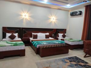 Ένα ή περισσότερα κρεβάτια σε δωμάτιο στο Shelton Elite Hotel +8 φωτογραφίες