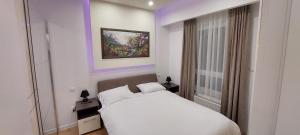 Ένα ή περισσότερα κρεβάτια σε δωμάτιο στο Extra Apartman +10 φωτογραφίες