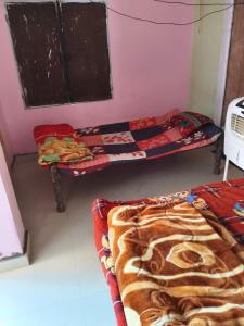 Ένα ή περισσότερα κρεβάτια σε δωμάτιο στο vijay singh rural homestay